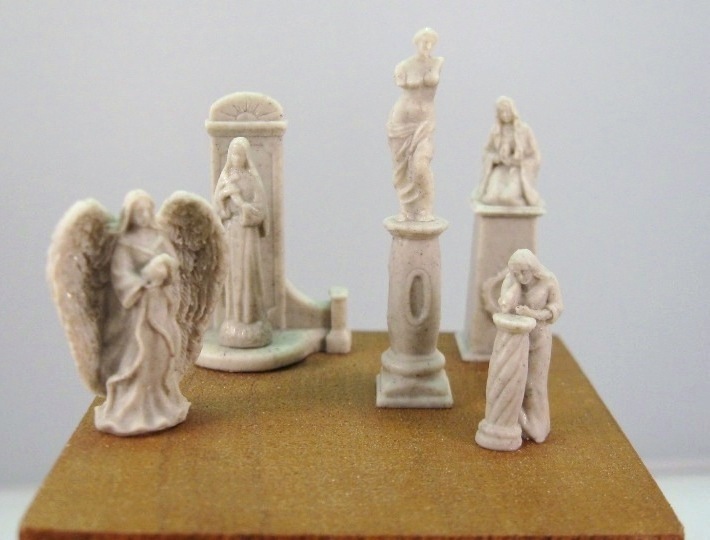 Small Statues and Pedestals Set